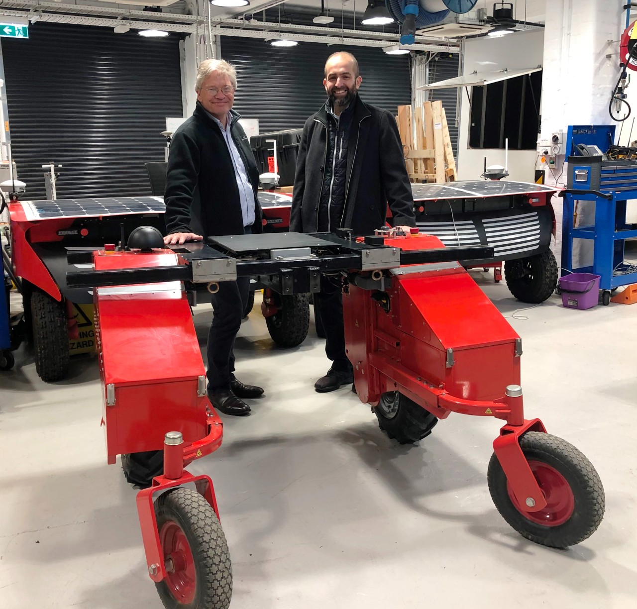 The Chief Scientist & Engineer and Professor Salah Sukkarieh at the Australian Centre for Field Robotics, standing behind a Digital Farmhand agricultural robot.