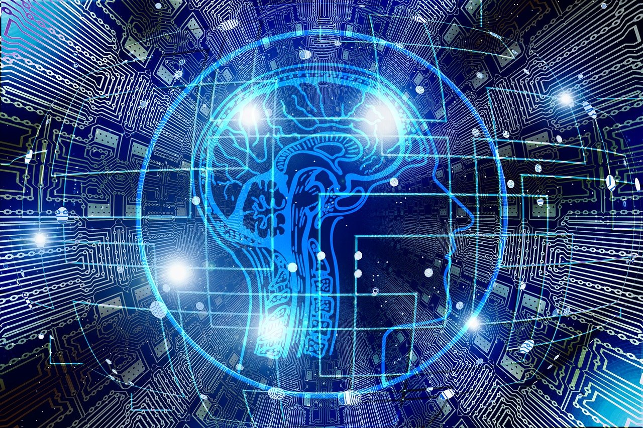 Diagram of a human brain in front of digital technologies.